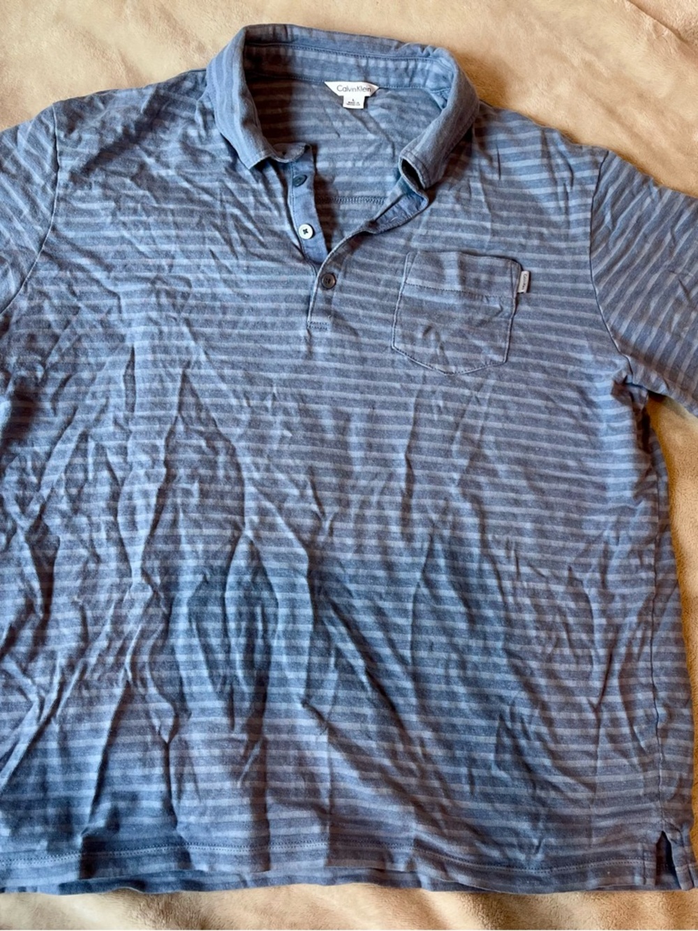 Calvin Klein Men’s Light and Medium Blue Striped Polo